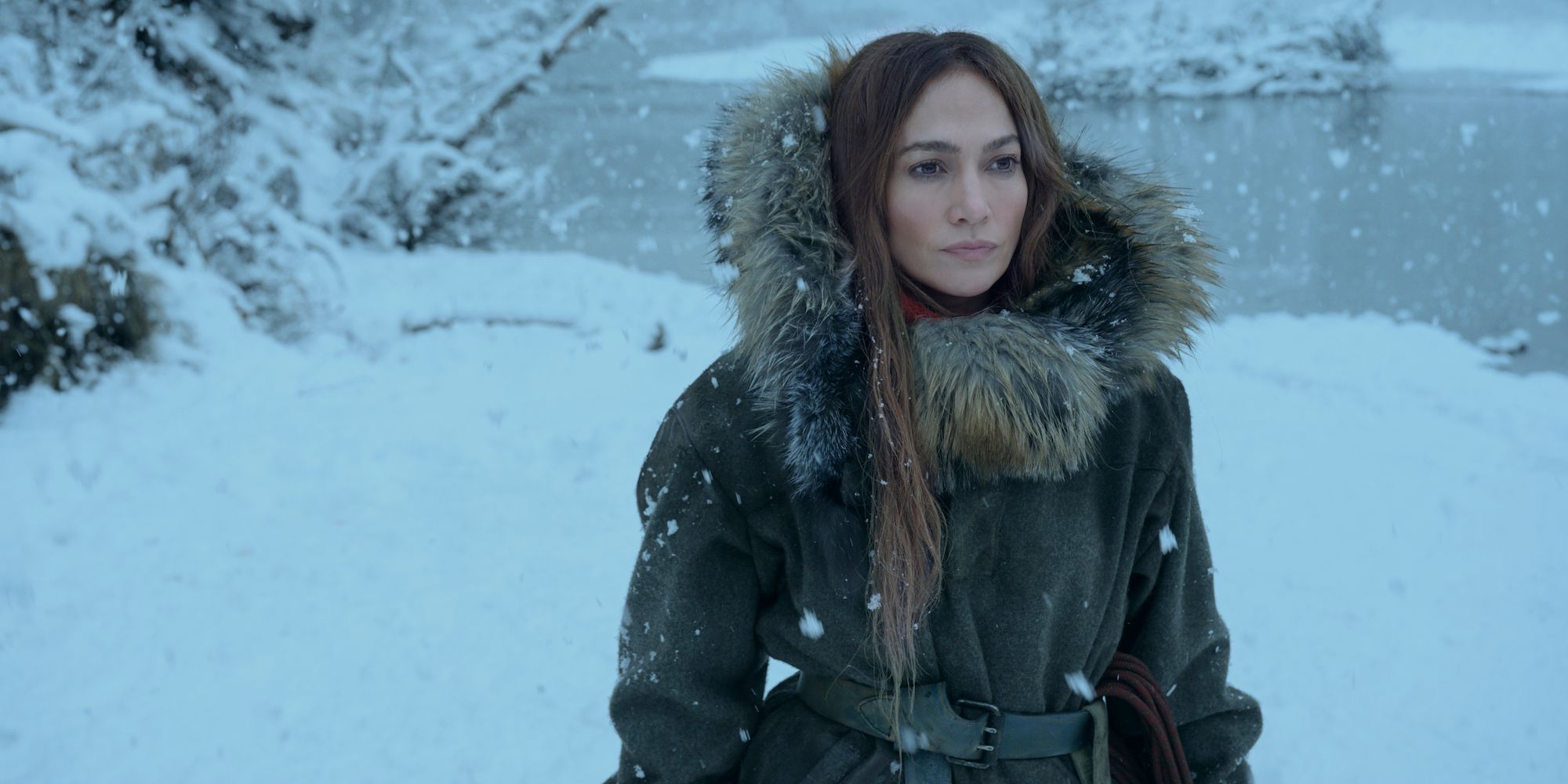 Jennifer Lopez standing in the snow in The Mother