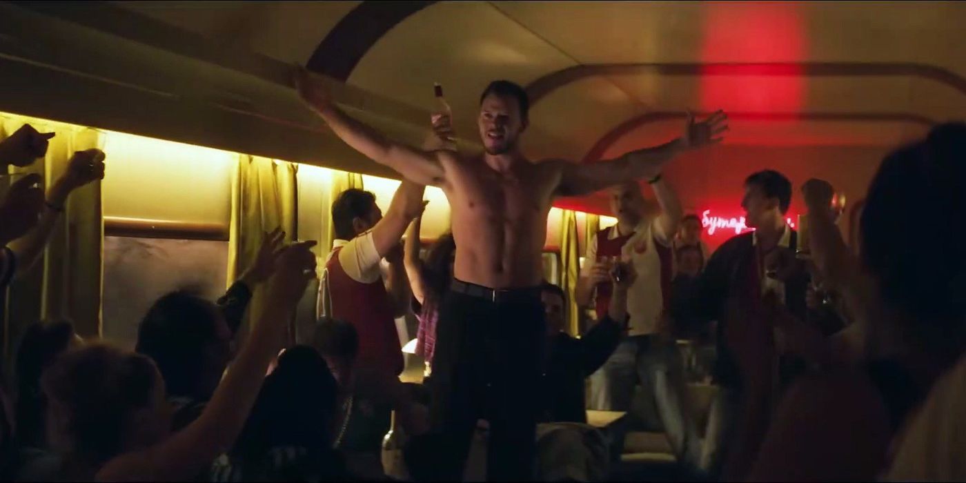 Jimmy Tatro as young Bert Kreischer with shirt off on a train in the Machine