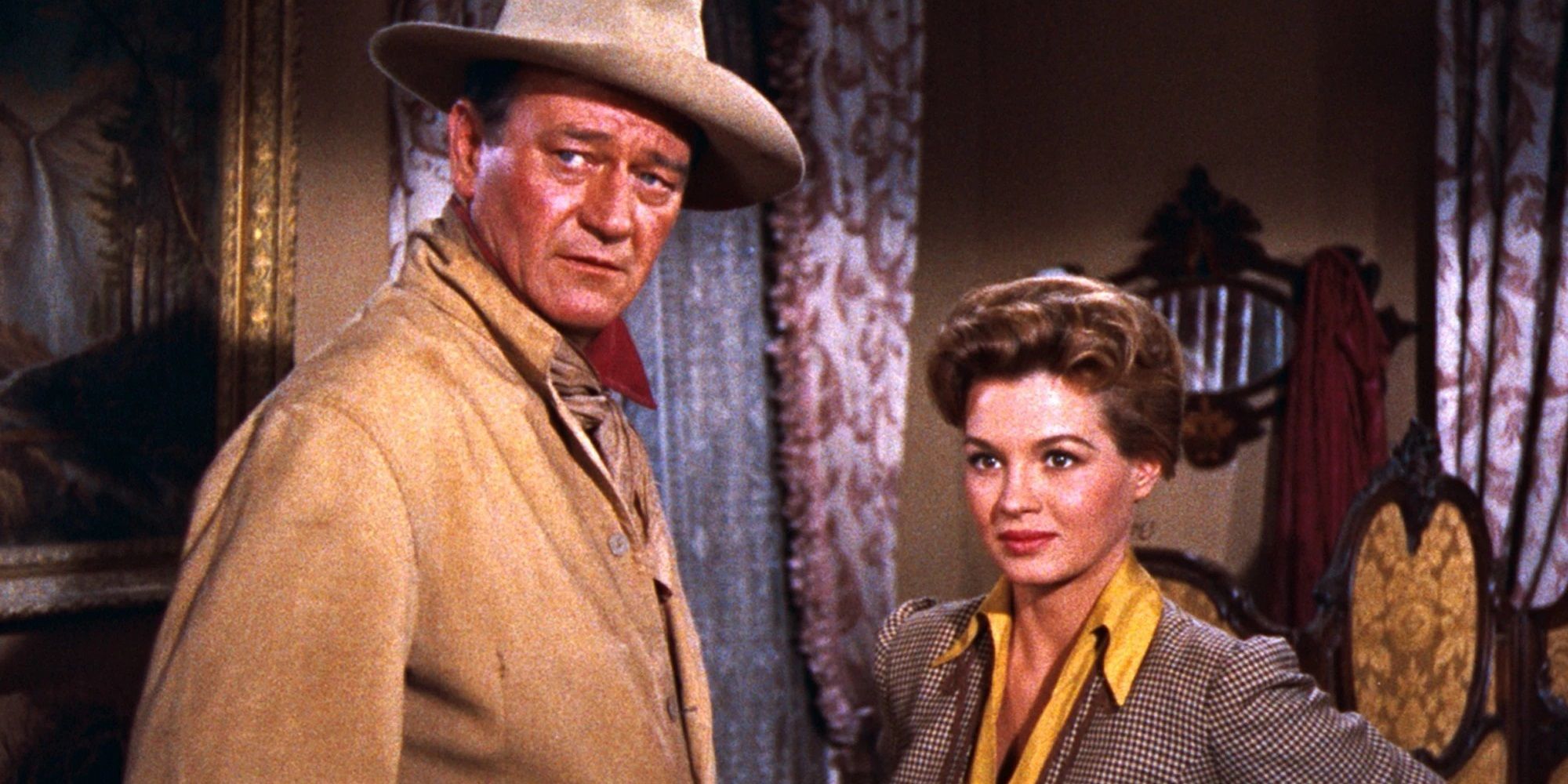 John Wayne e Angie Dickinson olhando fora da tela em Rio Bravo