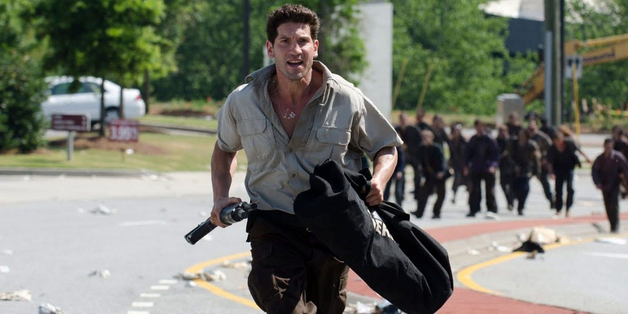 Jon Bernthal running from zombies in The Walking Dead