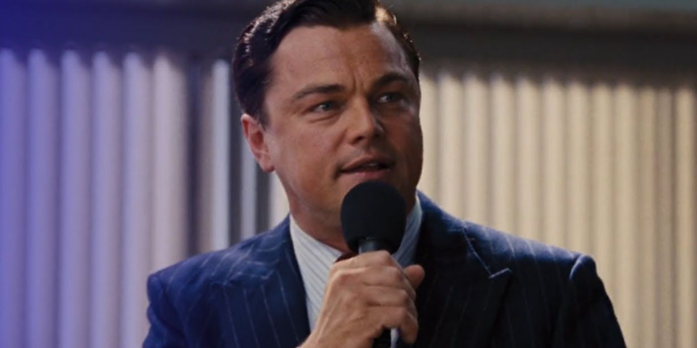 Jordan Belfort holding a microphone in The Wolf of Wall Street