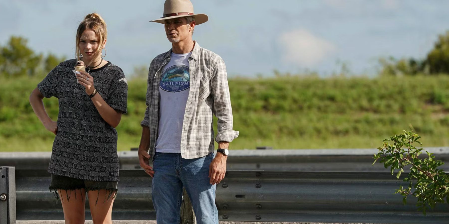 Willa and Raylan Givens standing on the side of a road in Justified: City Primeval