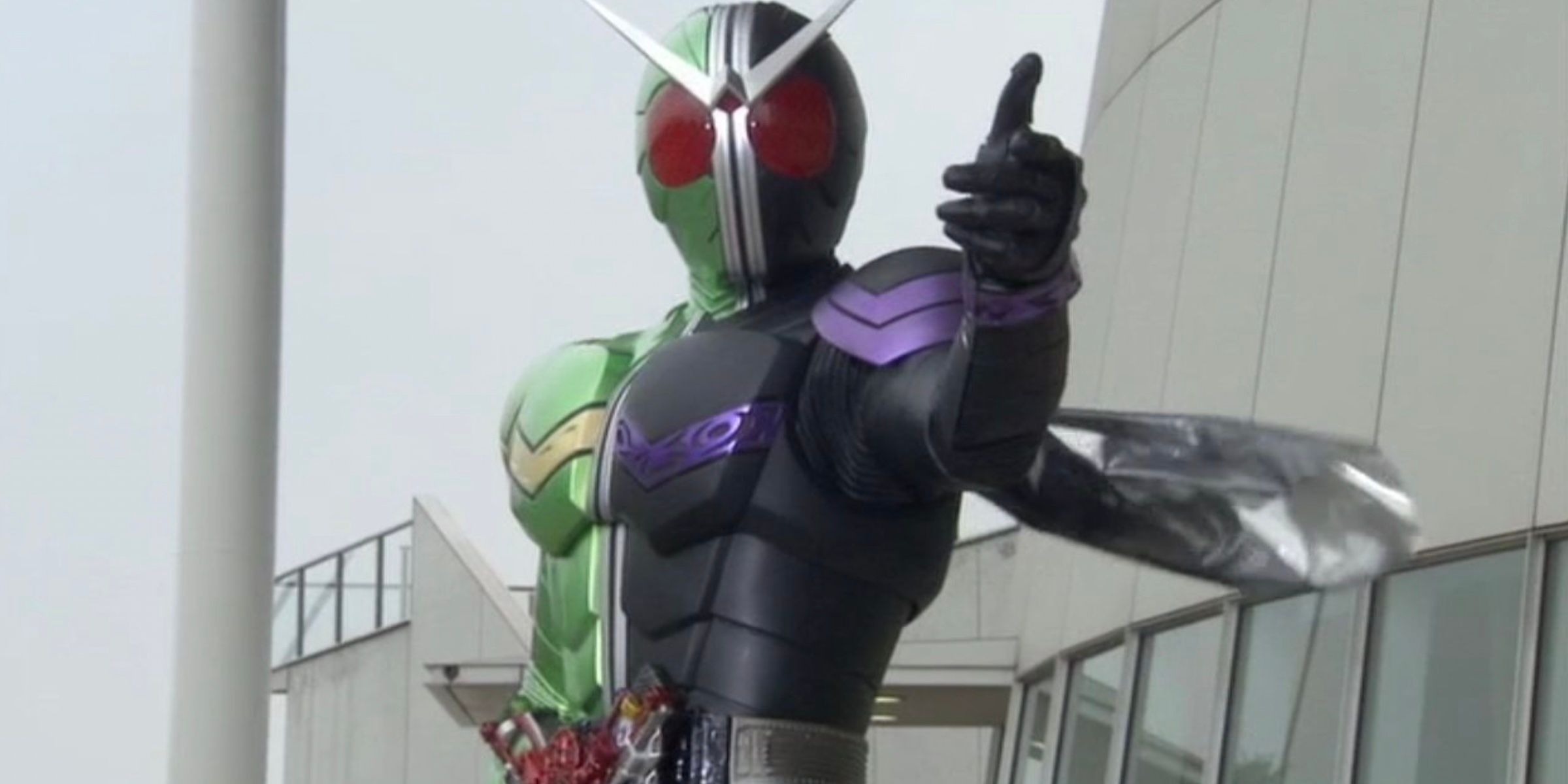 An image of the superhero in Kamen Rider W in his multicolored suit on the steps of a building