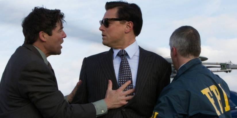 Kyle Chandler as FBI Agent Patrick Denham and Leonardo DiCaprio as Jordan Belfort with another FBI agent in the arrest scene in The Wolf of Wall Street