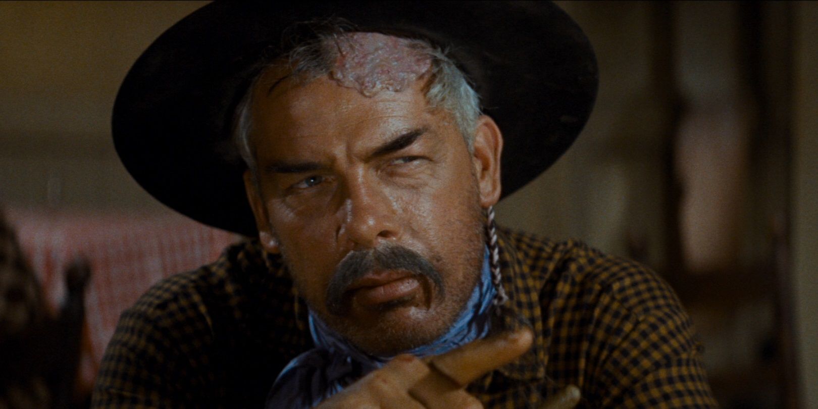 Lee Marvin looking off-screen in The Comancheros