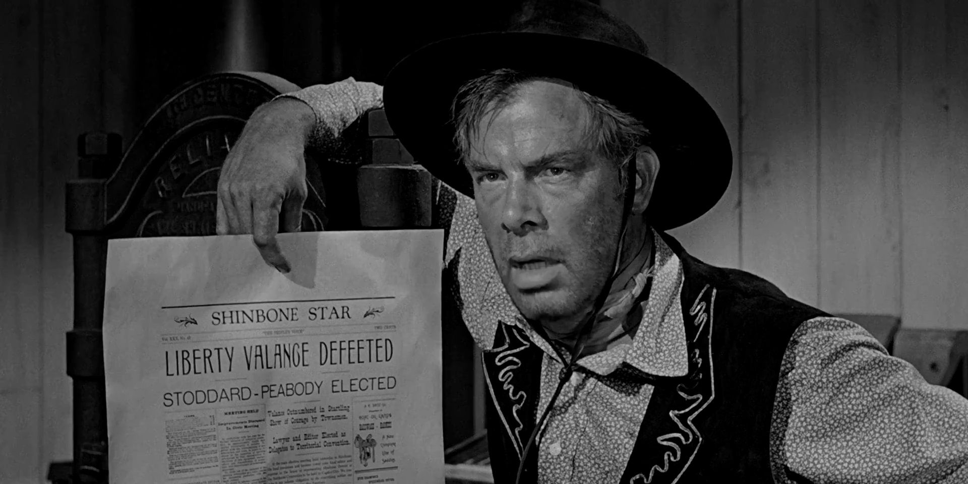 Lee Marvin with a newspaper in The Man Who Shot Liberty Valance