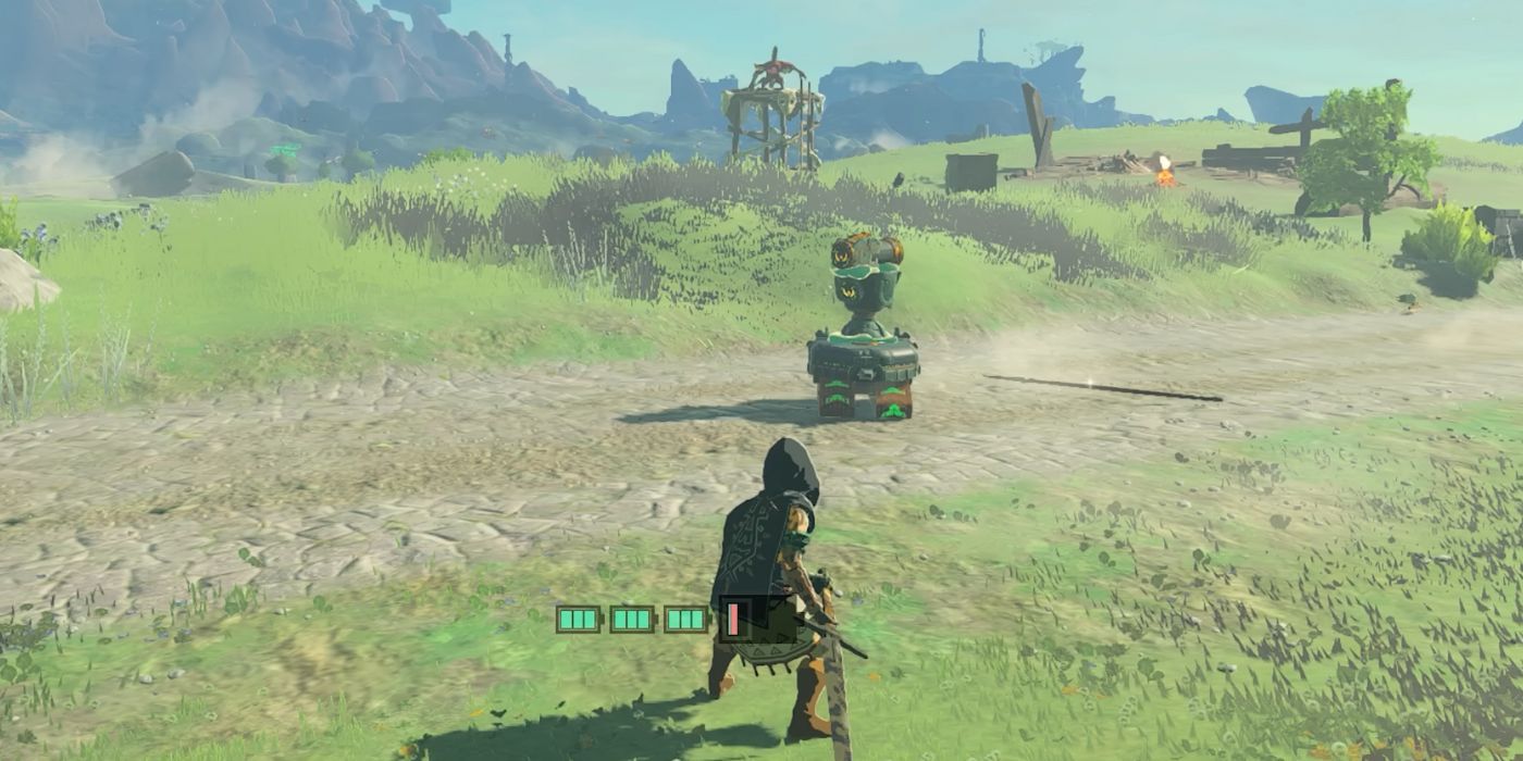 Link standing behind a Homing Cart with an attached Construct Head in Tears of the Kingdom.