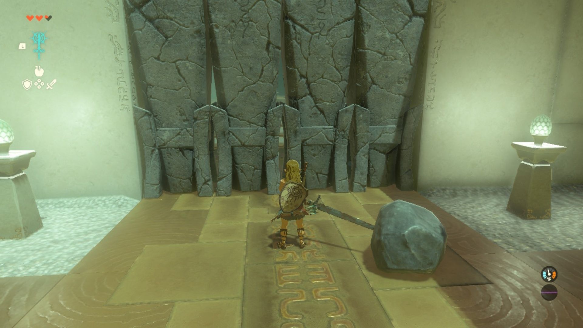 Link holding a fused sword and boulder weapon in front of a rock barrier