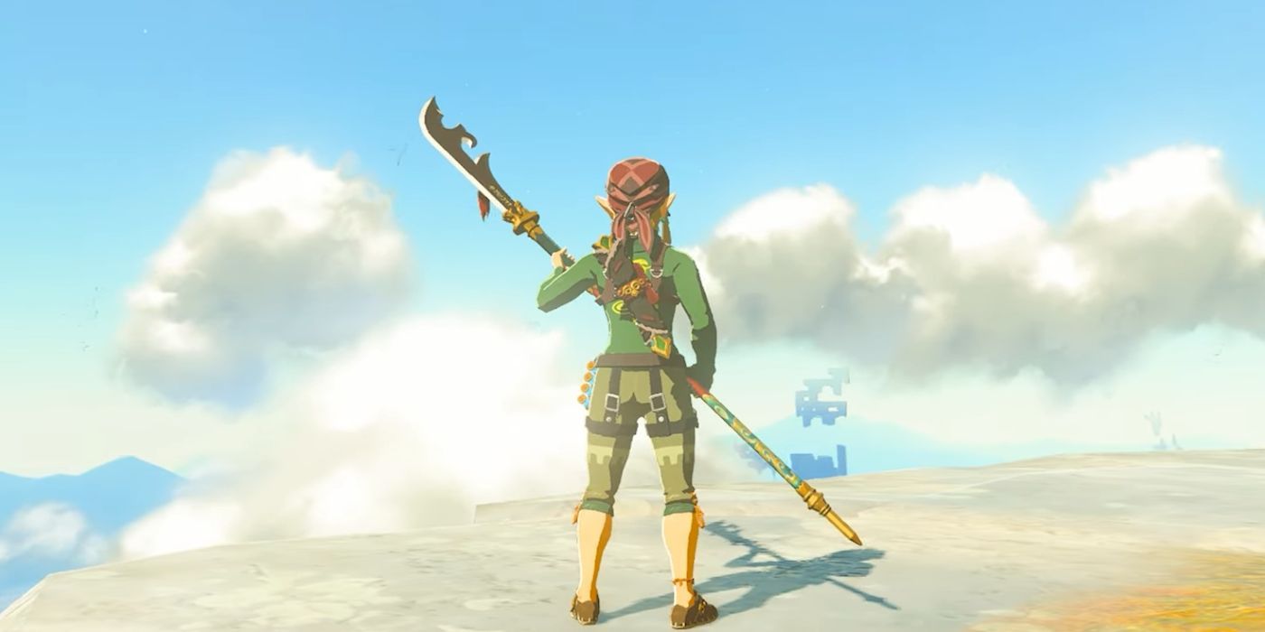 Link standing on a cliff and holding the Gloom Spear in Zelda: Tears of the Kingdom.