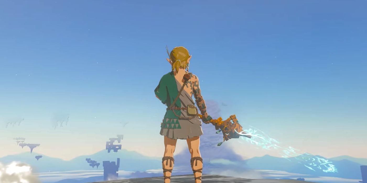 Link standing on a cliff and holding the Mighty Zonaite Longsword in Zelda: Tears of the Kingdom.