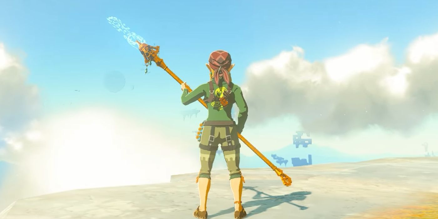 Link standing on a cliff and holding the Mighty Zonaite Spear in Zelda: Tears of the Kingdom.