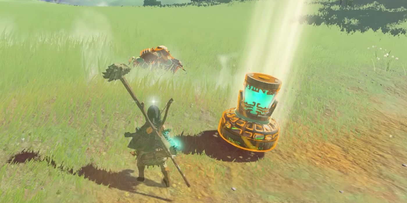Link using Ultrahand to pick up a Big Battery attached to a Fan in Tears of the Kingdom.