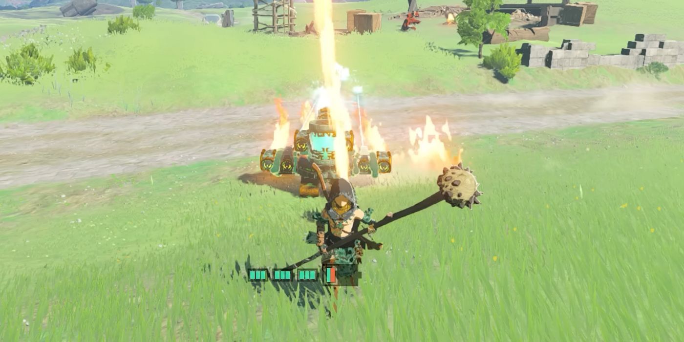 Link standing in front of a Homing Cart in Tears of the Kingdom, which is accessorized with Flame Emitters.