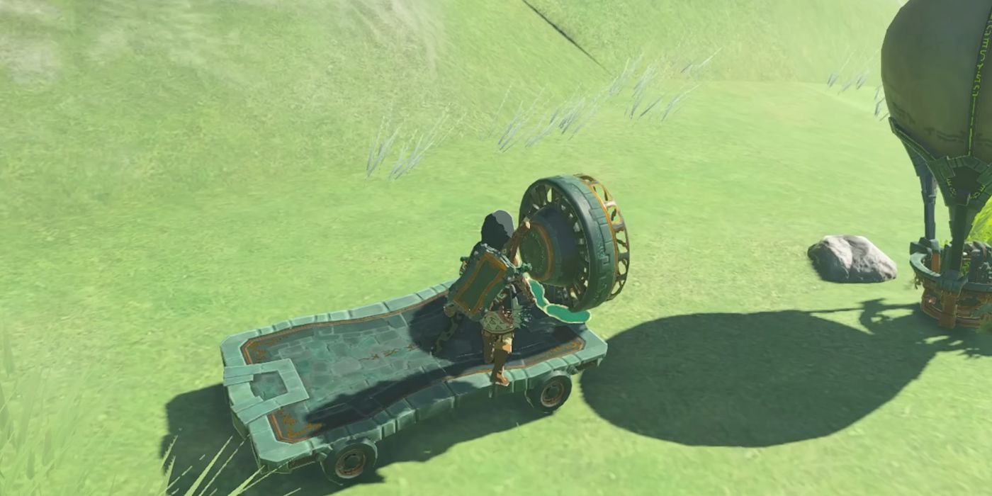 Link standing on top of a Cart with an attached Fan in Tears of the Kingdom.
