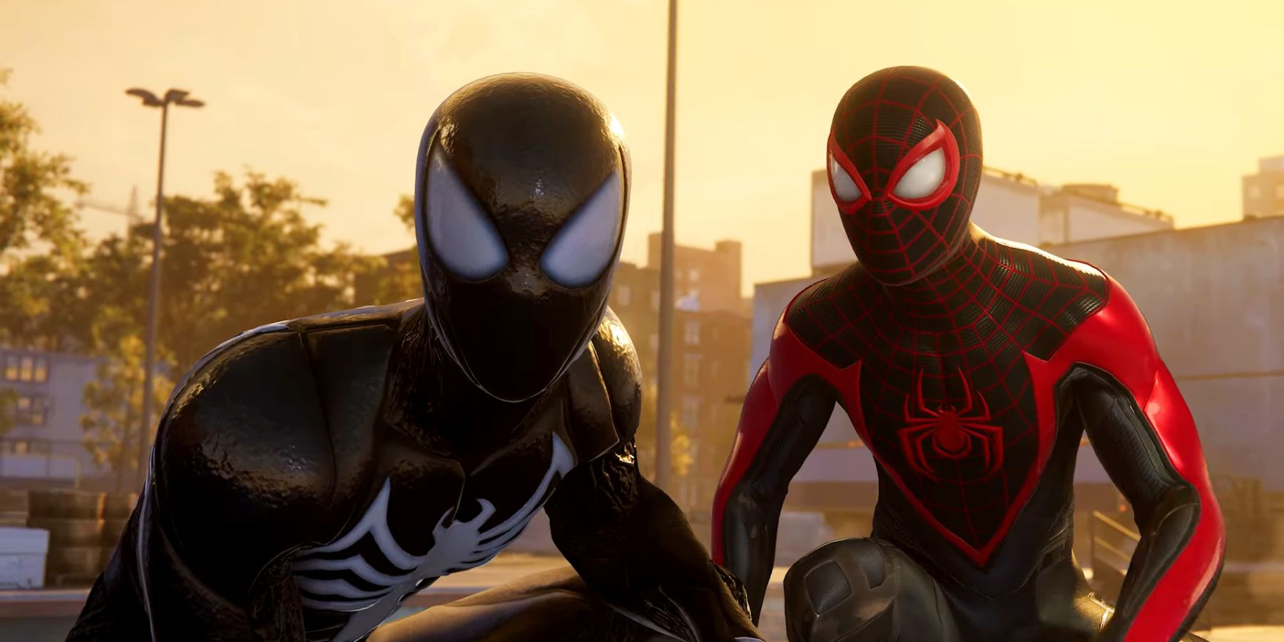 Peter Parker and Miles Morales side-by-side, with the former in a suit of the Venom symbiote. Behind them are industrial buildings and an orange sky.