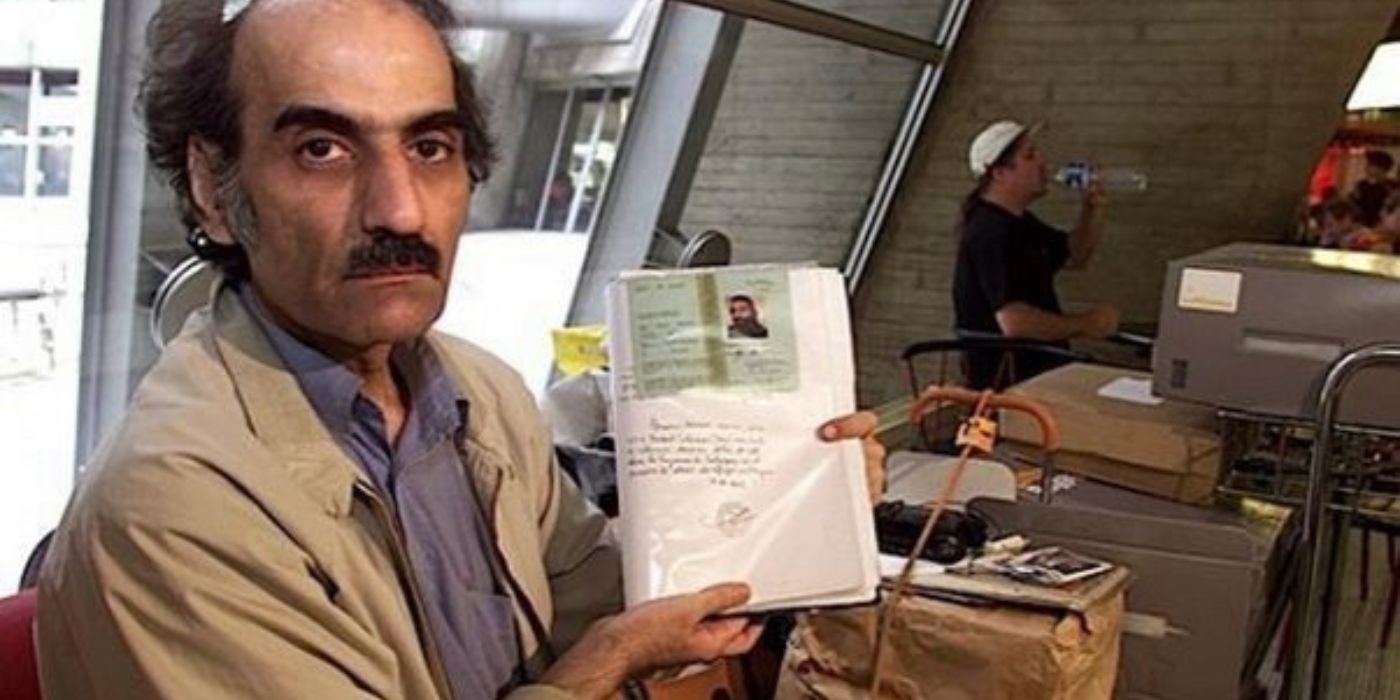 Mehram Nasseri holding a document at Charles De Gaulle airport