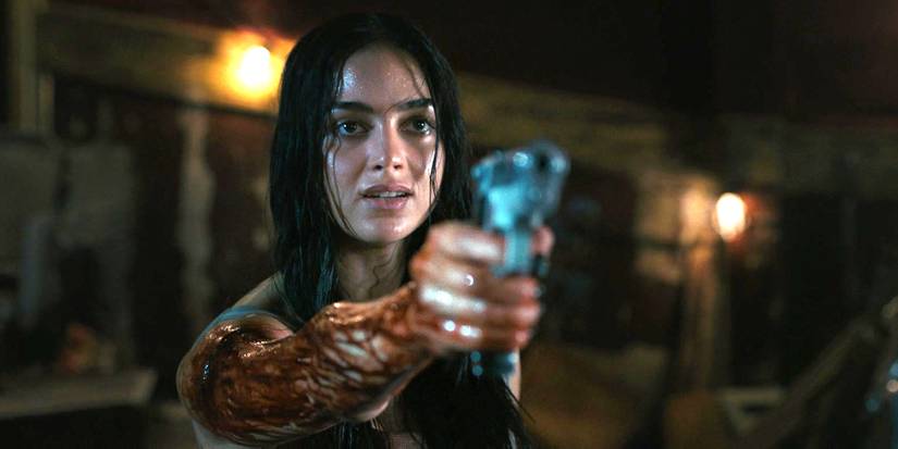 Melissa Barrera pointing a gun as Sam Carpenter in Scream 6