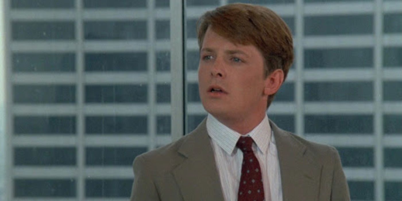 Michael J. Fox looks surprised in The Secret of My Success 