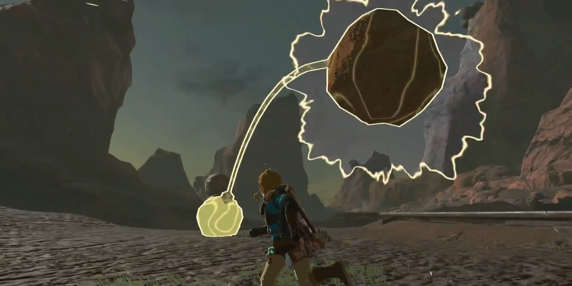 Using the Recall ability, Link directs a flying boulder back at an Octorok in Tears of the Kingdom