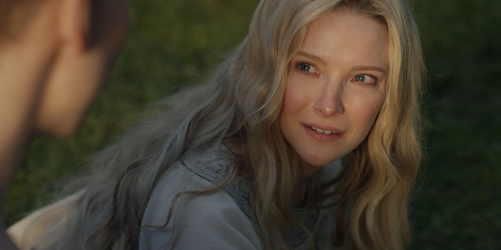 Galadriel looking up at Sauron's illusion of her brother in The Lord of the Rings The Rings of Power Season 1 Episode 8