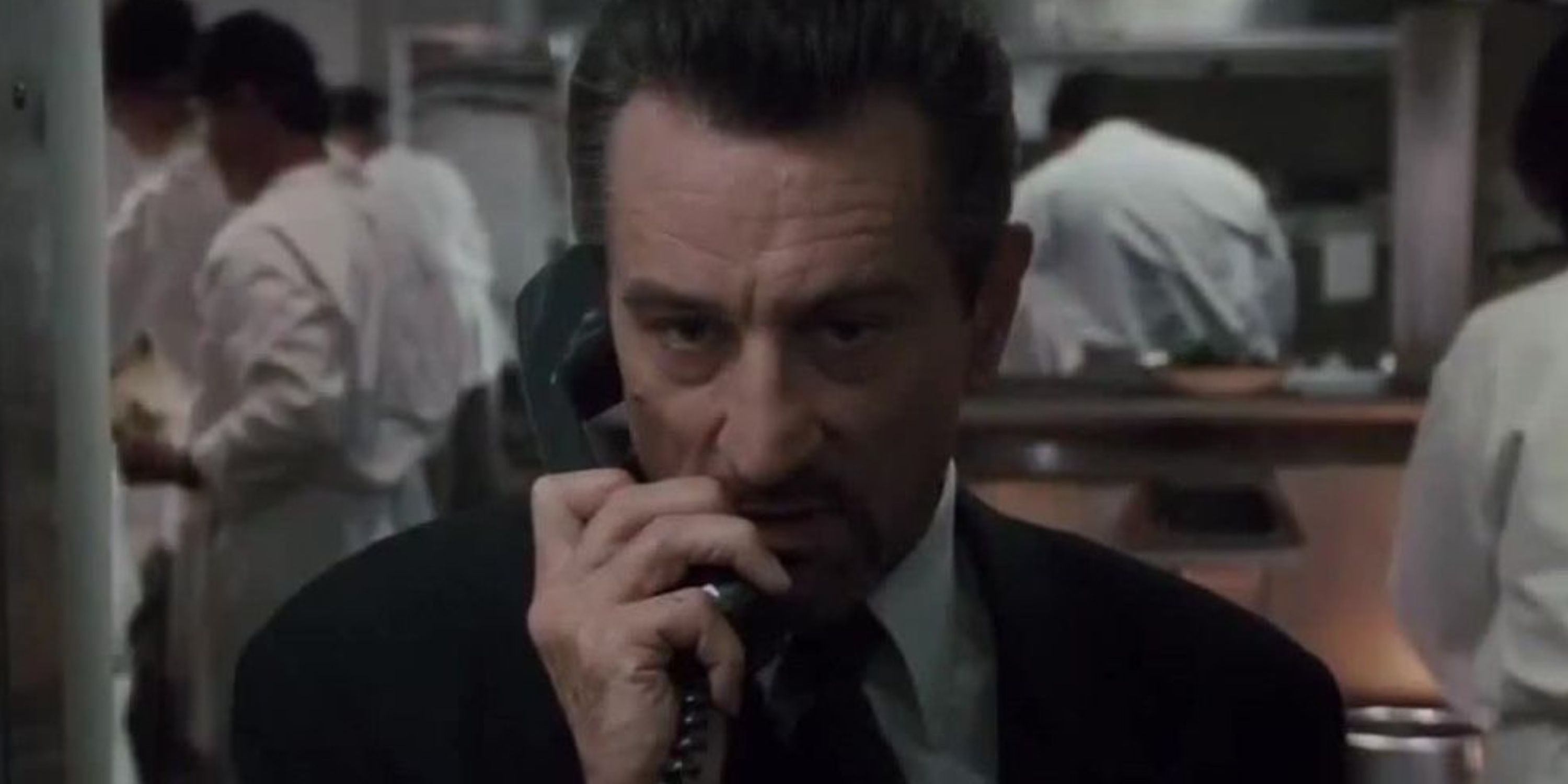 Robert De Niro as Neil talking on the phone in Heat