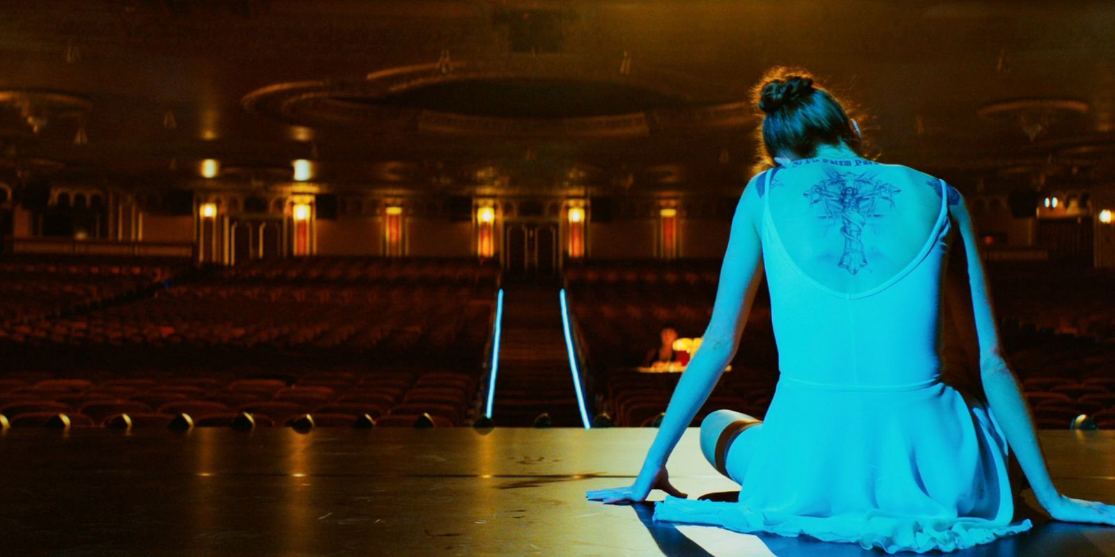 Rooney the ballerina in sitting on a stage in John Wick: Chapter 3