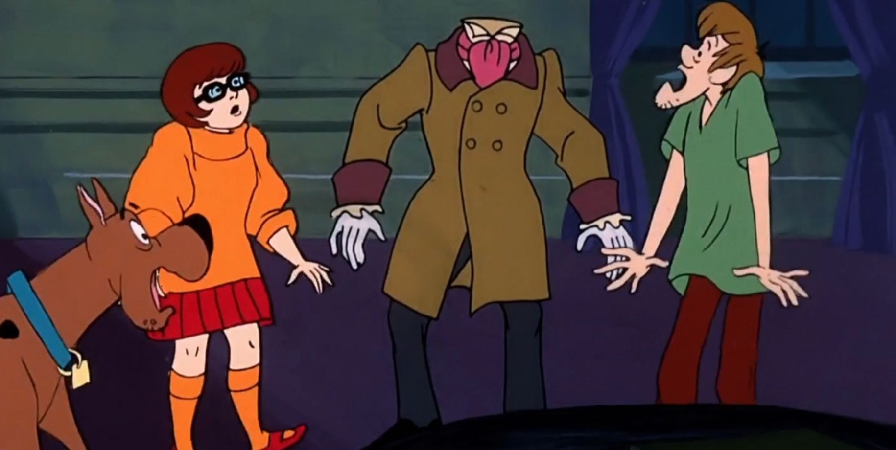 Scooby, Velma, and Shaggy scared by a headless ghost in a Scooby-Doo episode Haunted House Hang-up