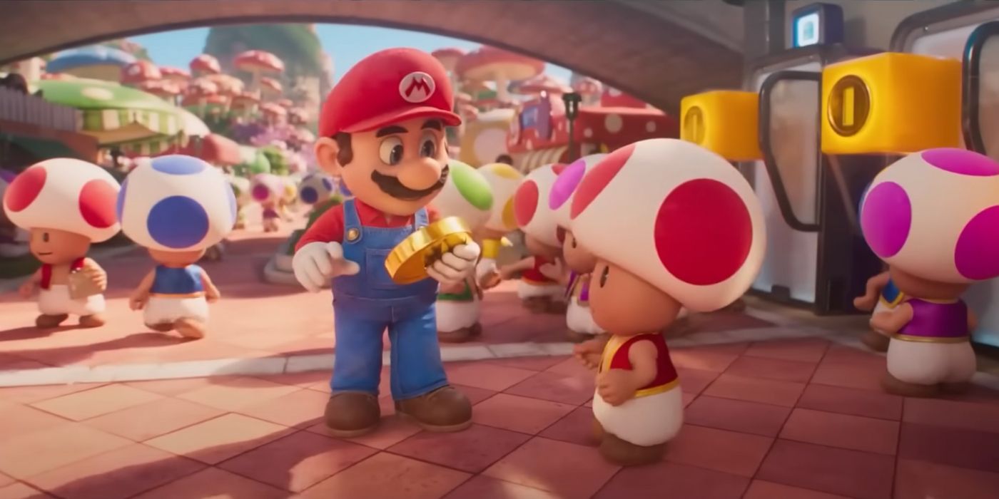 Mario tenant une pièce entouré de champignons dans le film Super Mario Bros