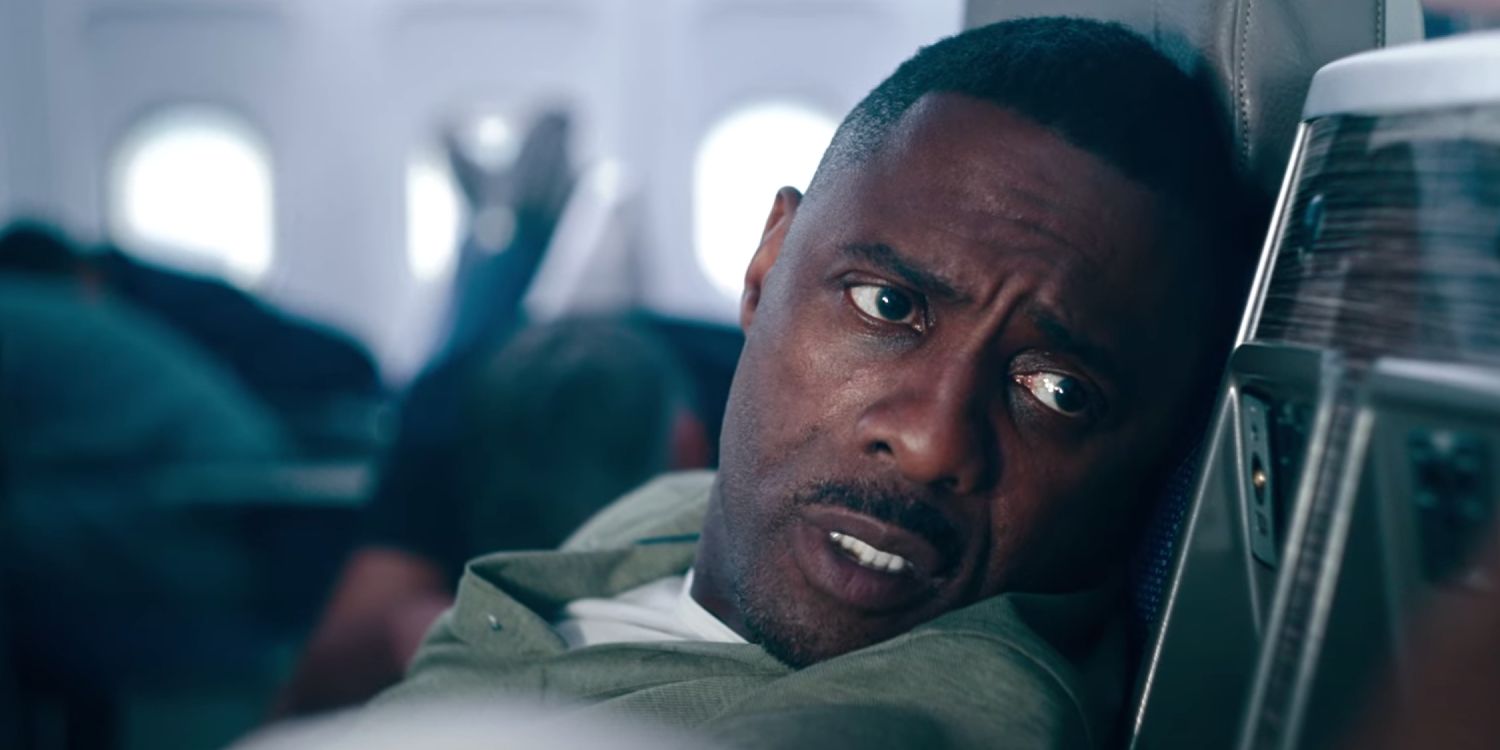 Idris Elba reassuring a plane passenger in Hijack