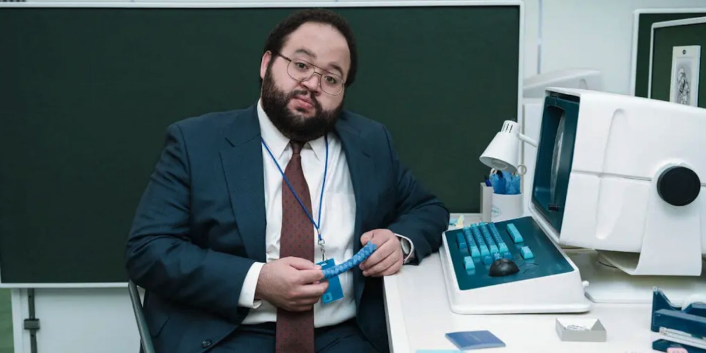 Severance season 1 Dylan R in front of a computer played by Zach Cherry