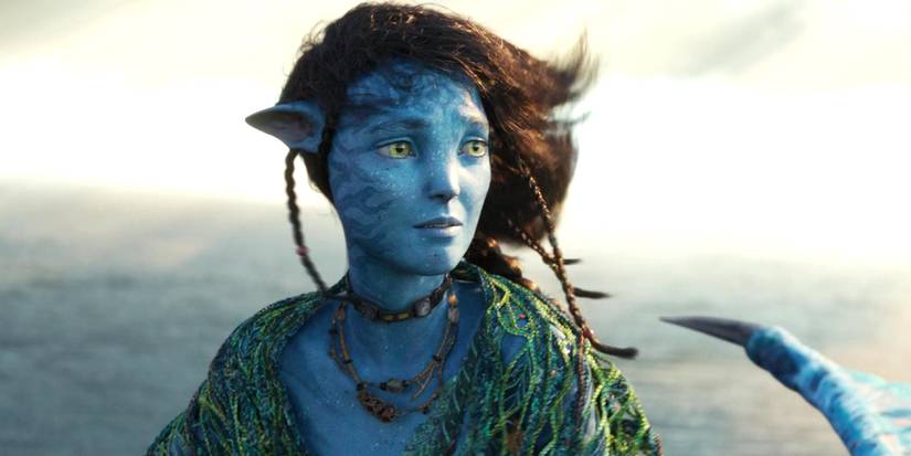Sigourney Weaver's Kiri looking sadly over her shoulder in Avatar: The Way of Water