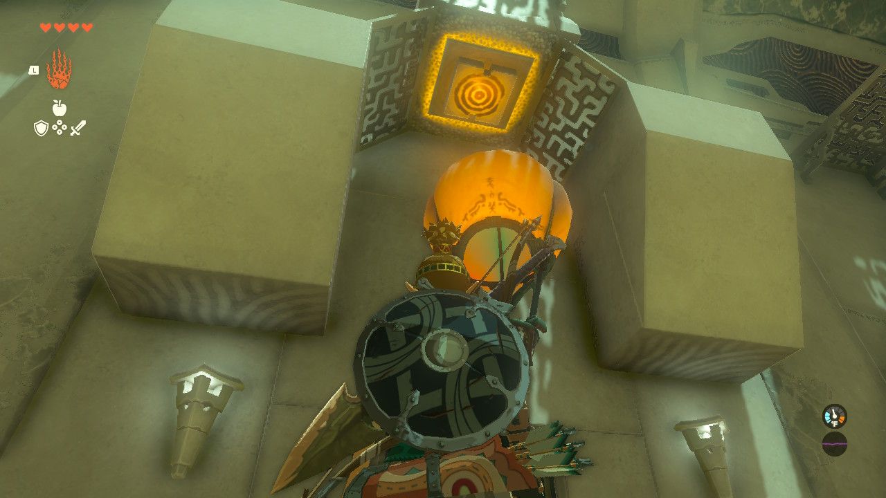 Link looking at a floating device with a button above it