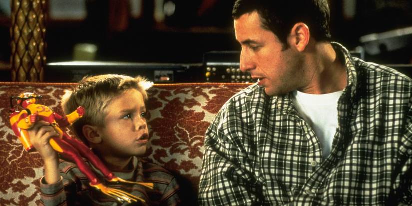 Sonny sits on the couch with Julian in Big Daddy