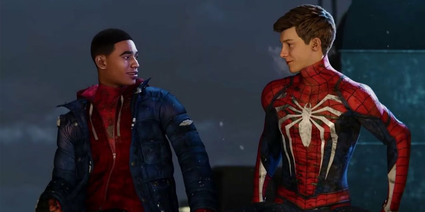 Peter and Miles sit unmasked on a snowy rooftop in Spider-Man: Miles Morales