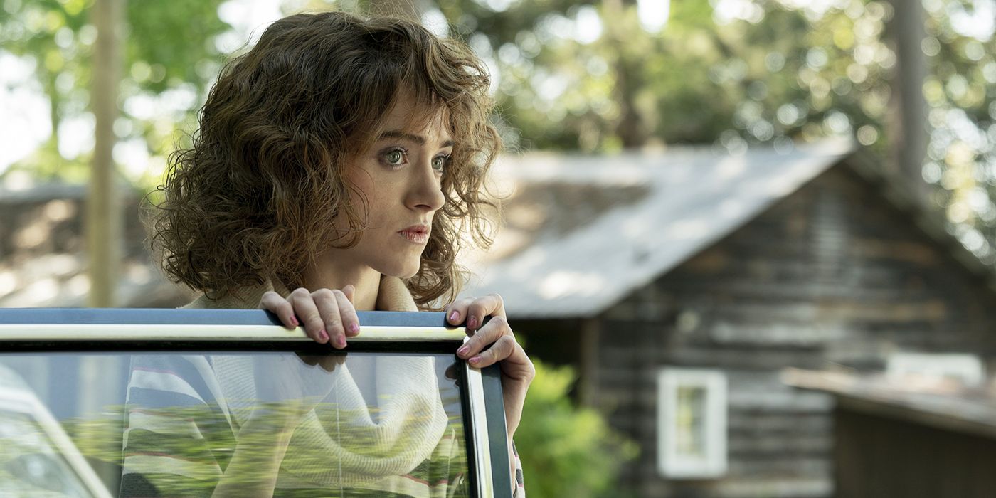 Natalia Dyer standing by a car as Nancy in Stranger Things