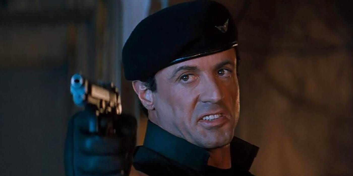 Sylvester Stallone points a gun in Demolition Man