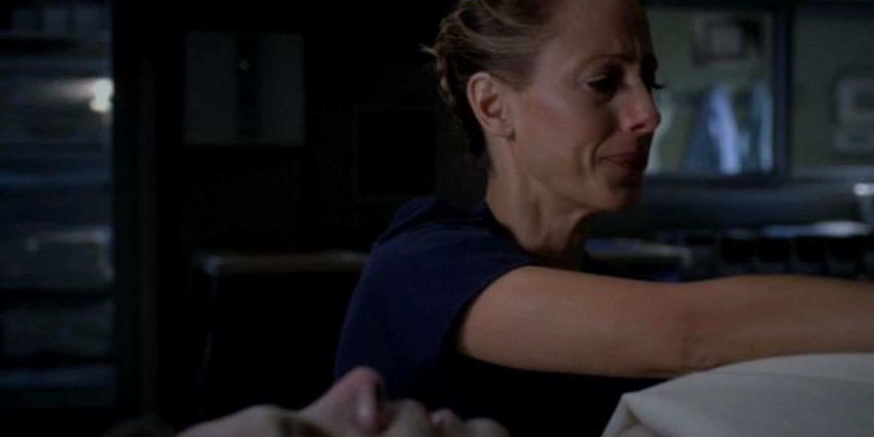 Teddy cries while covering Henry's body in Grey's Anatomy