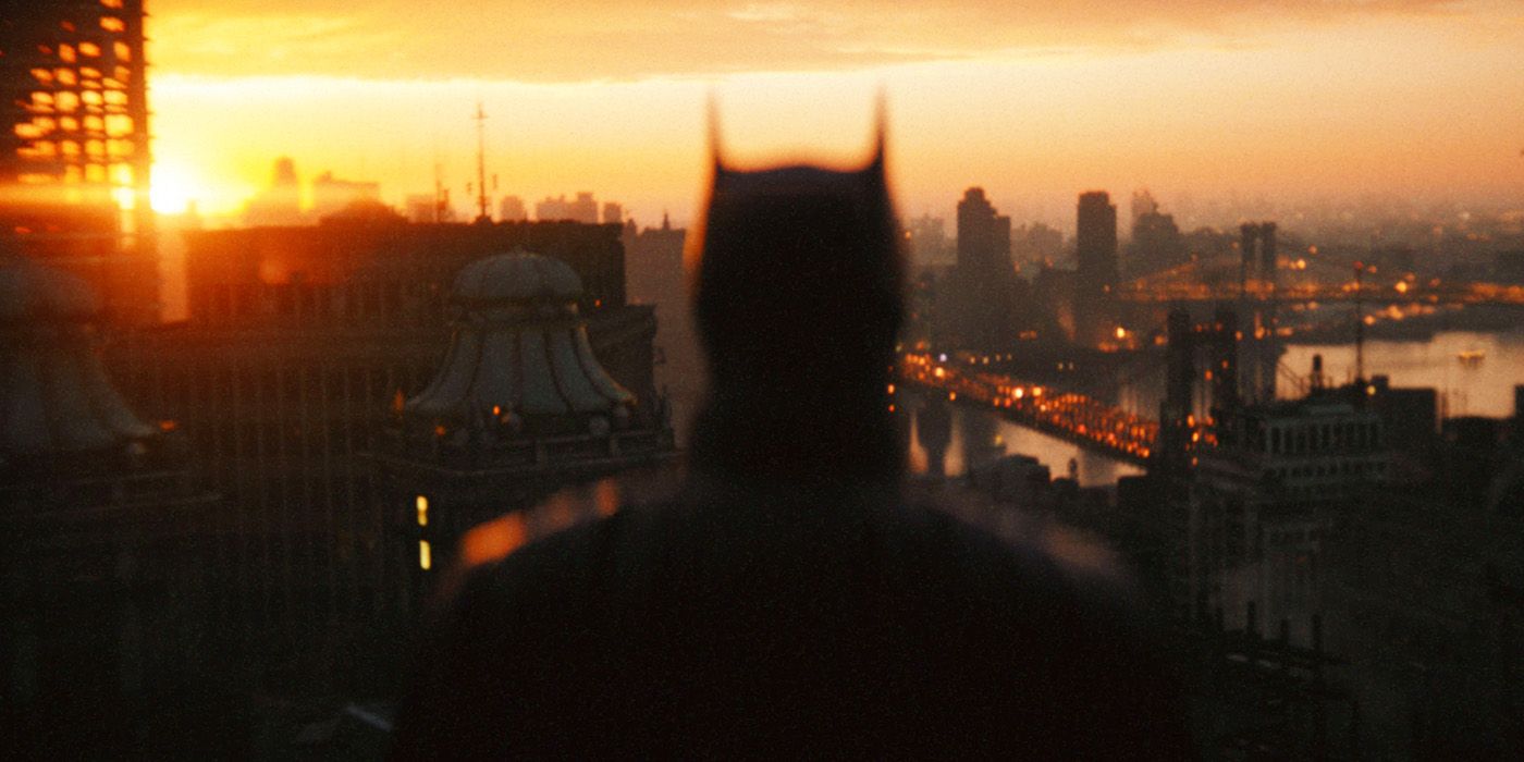 Bruce looks over a Gotham City sunrise in The Batman