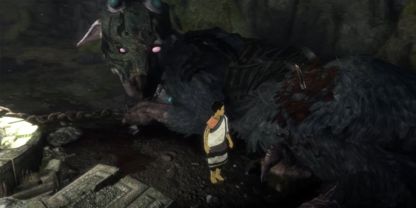 Um menino olha para as feridas de Trico na cena de abertura de The Last Guardian