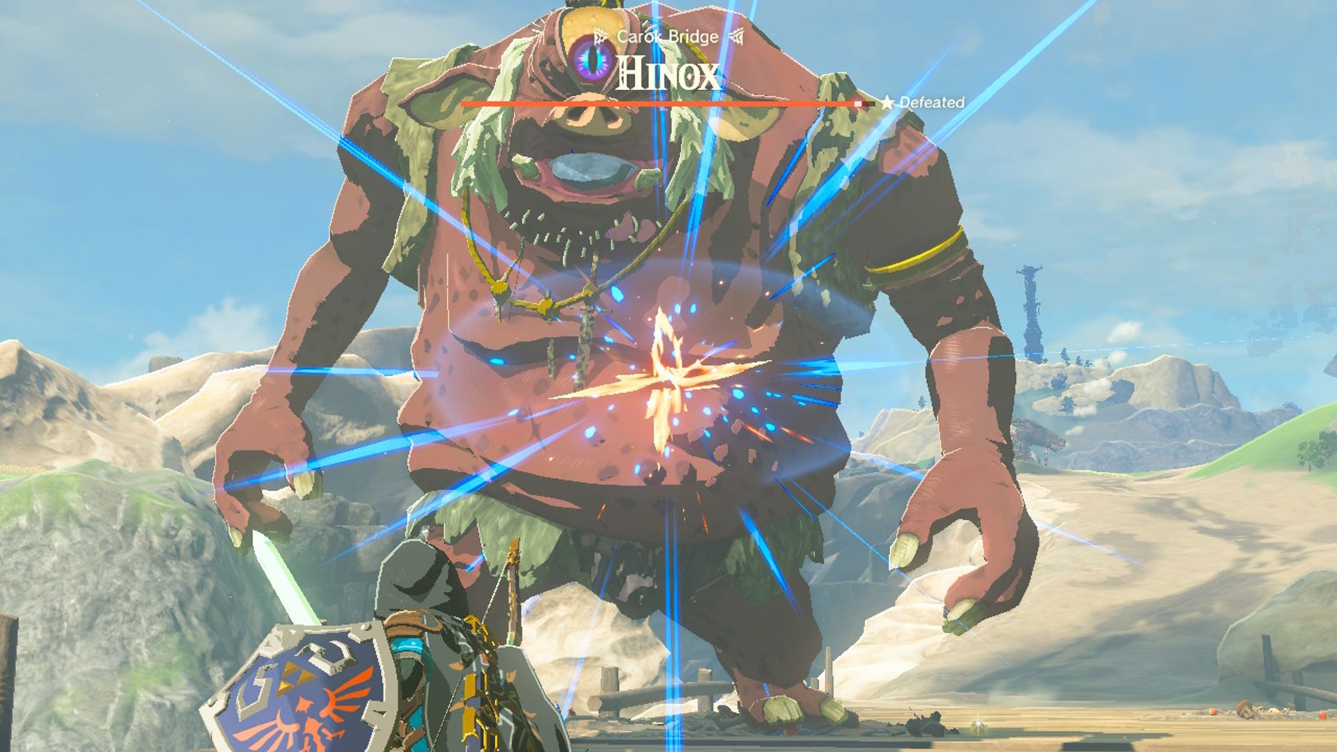 The Legend Of Zelda Tears Of The Kingdom Link Attacking Carok Bridge Hinox With Ranged Master Sword Attack From Champion's Leathers