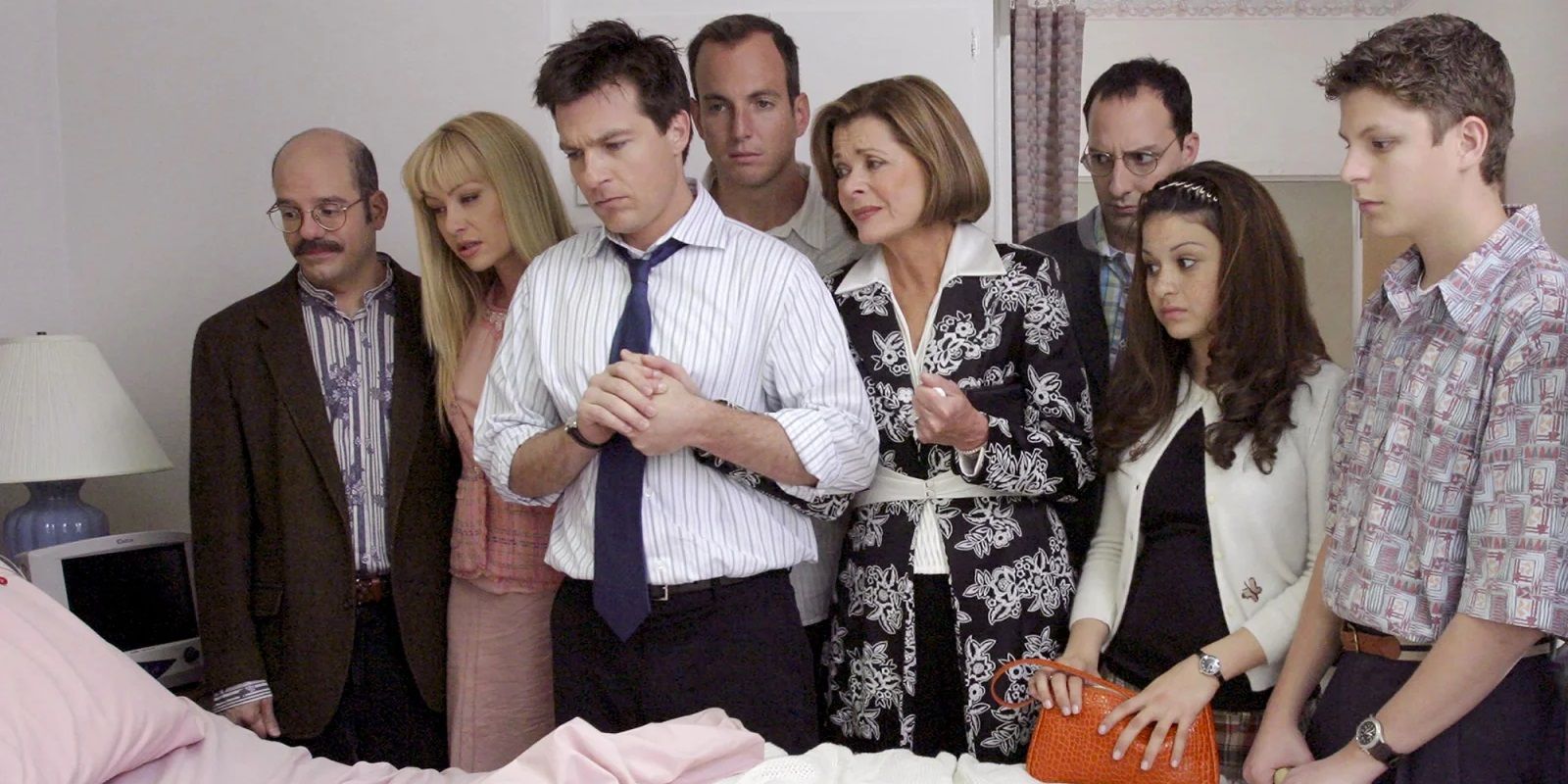 The Bluths stand over a hospital bed in Arrested Development