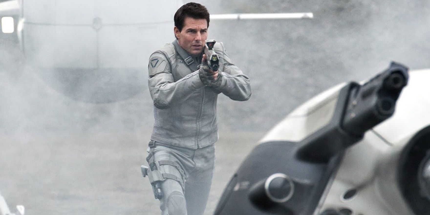 Tom Cruise with a gun in Oblivion