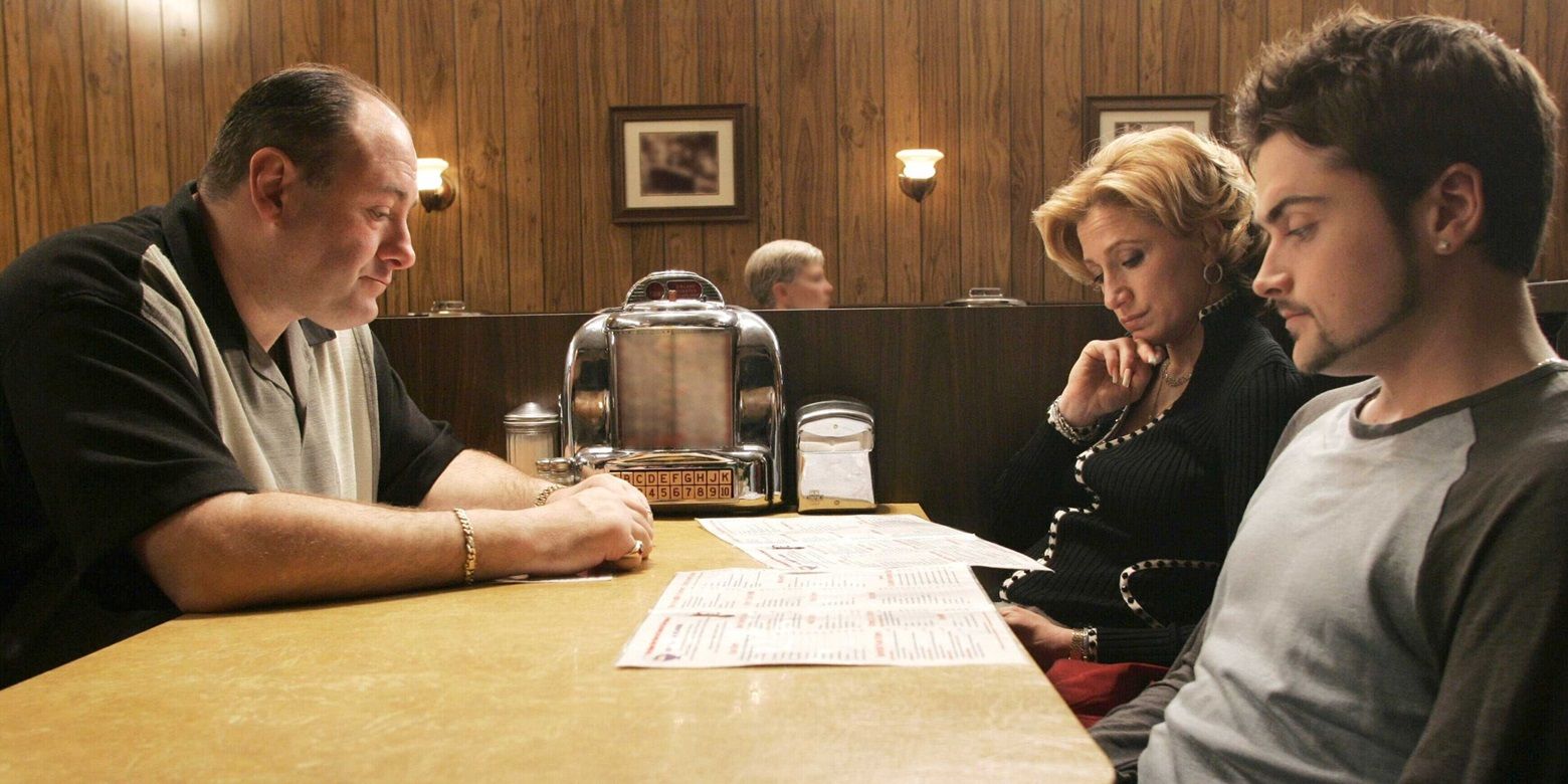 Tony at a restaurant with Carmela and AJ in The Sopranos