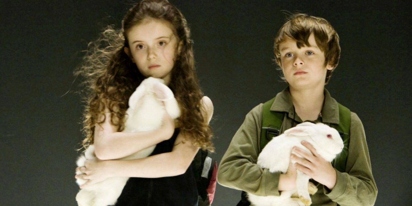 Two child actors holding rabbits in Knowing