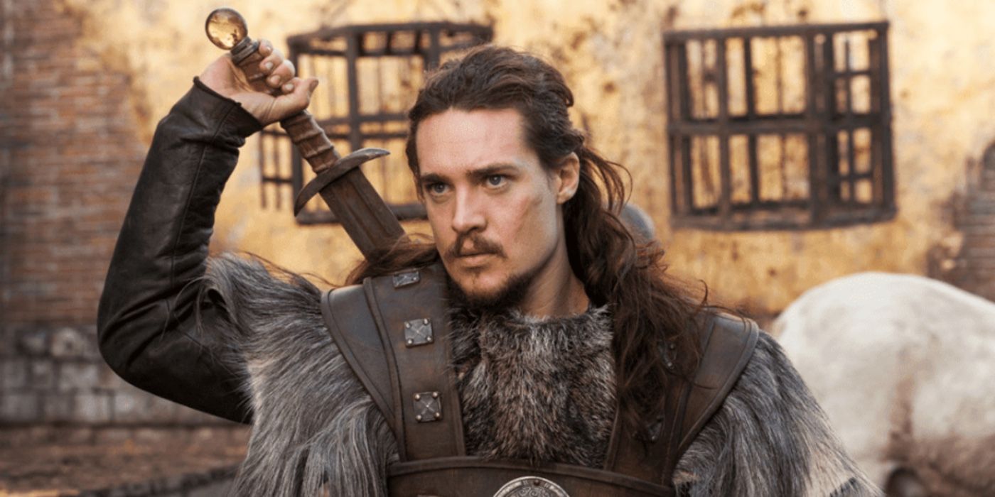 Alexander Dreymon as Uhtred drawing his sword in The Last Kingdom
