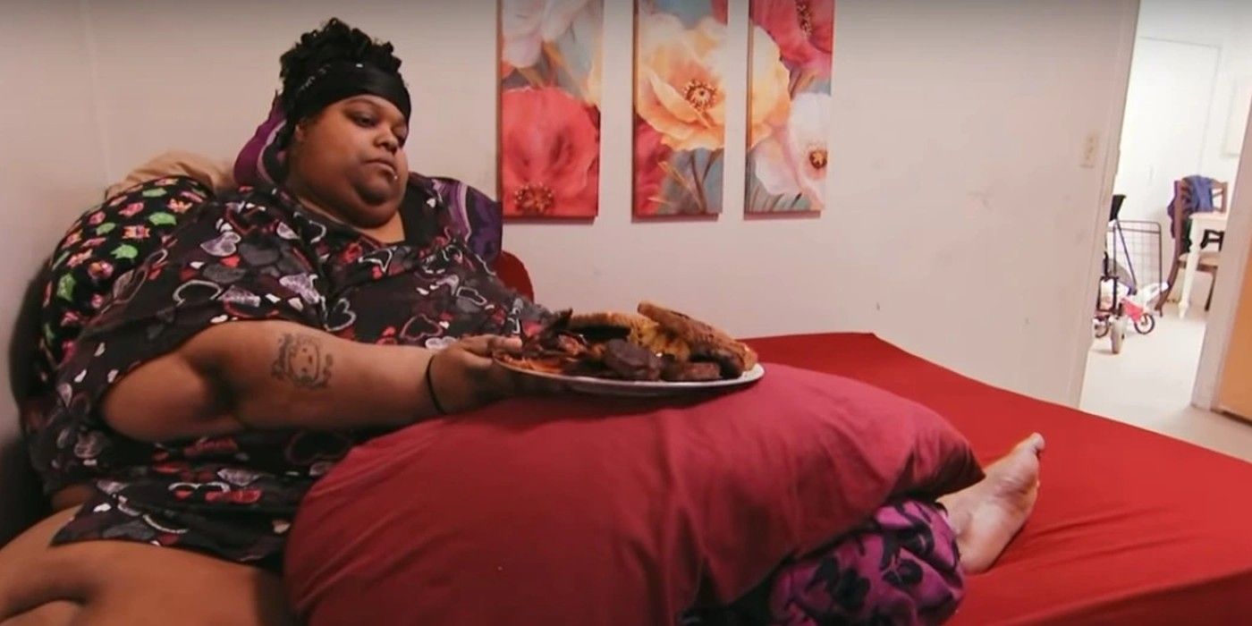 Mercedes Cephas from my 600-lb life in bed eating a plate of food