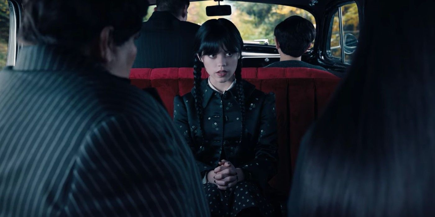 Wednesday in the car with Morticia and Gomez Addams