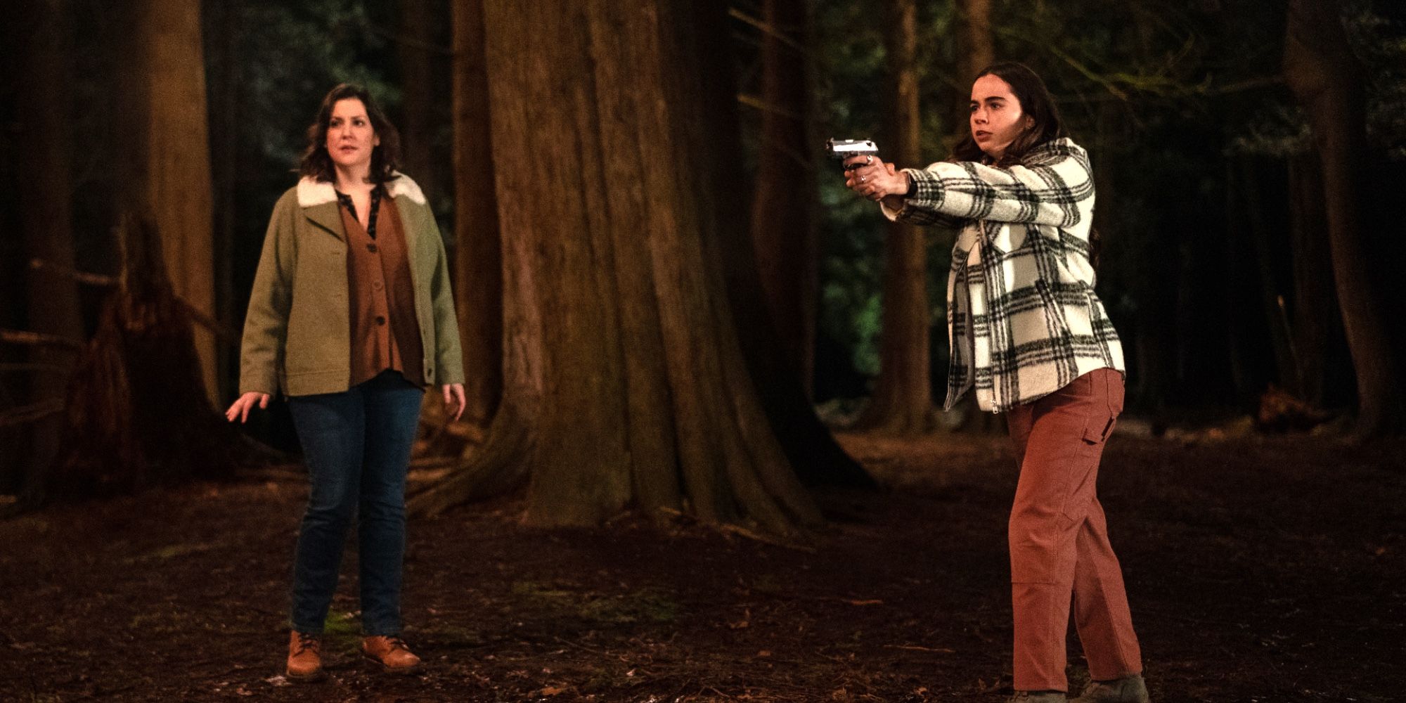 Callie holding a gun next to Shauna in Yellowjackets Season 2 Episode 9