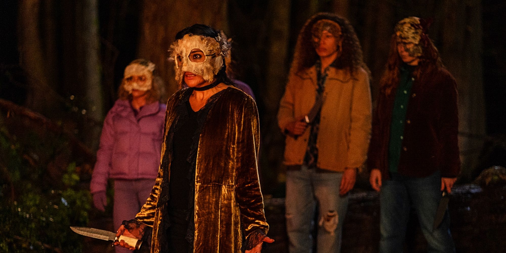 Adult Lottie Misty Tai and Van wear animal masks for the hunt in Yellowjackets Season 2 Episode 9