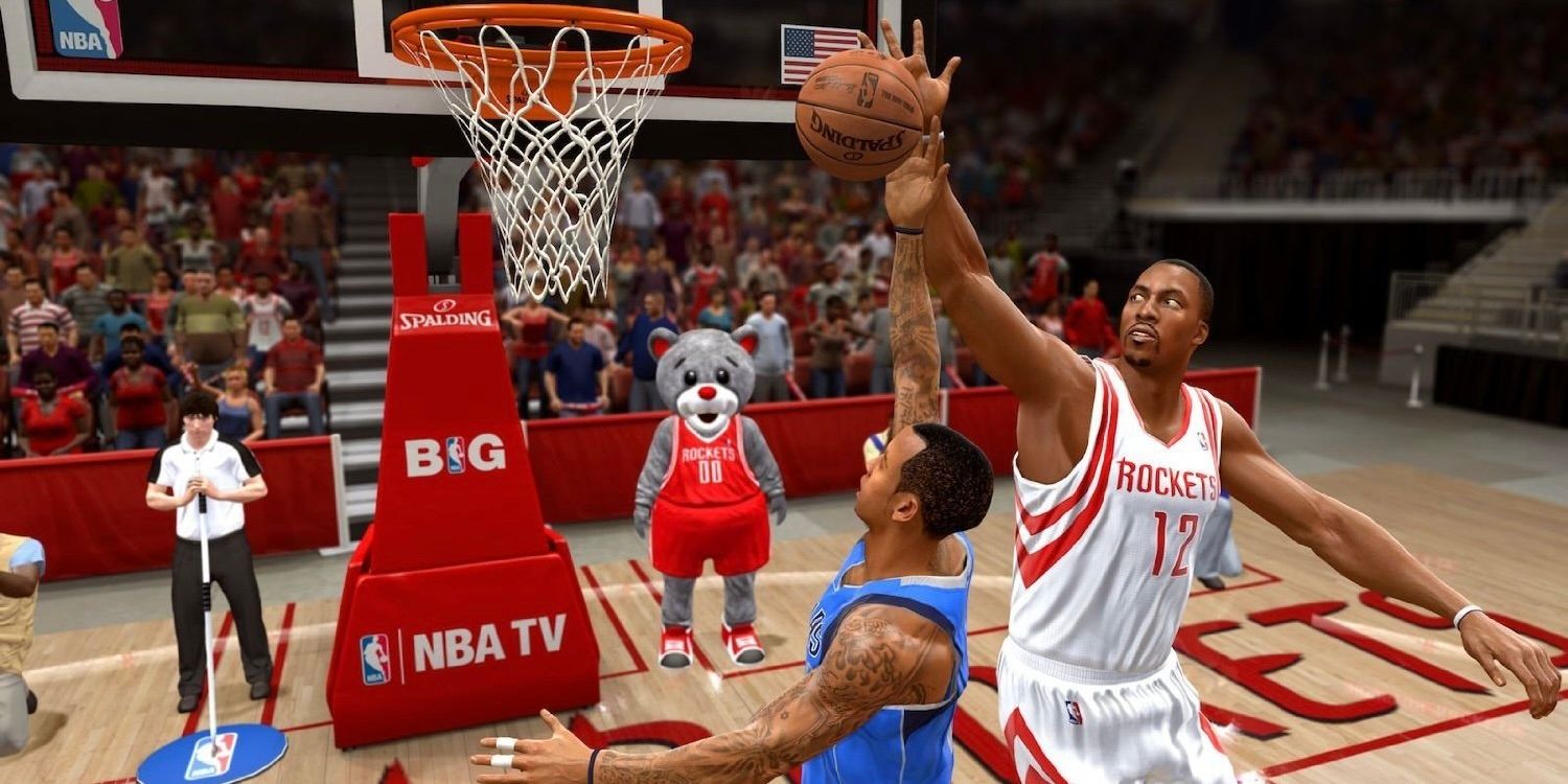 A screenshot from NBA Live 14 shows a player from the blue team taking a shot while a player from the white team defends